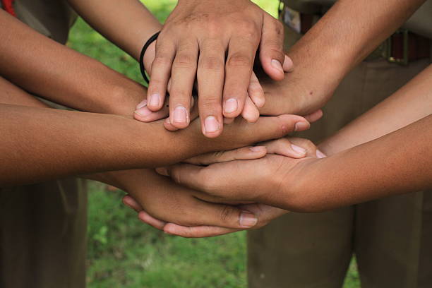 istock Holding hand together with strong concept about teamwork and cooperation 626444056