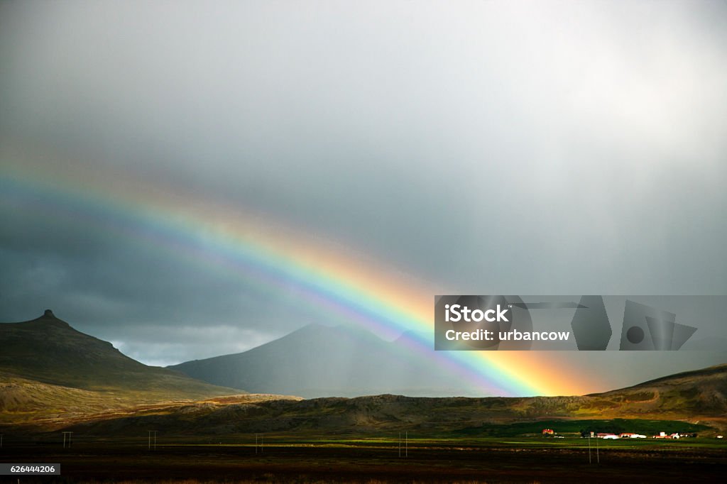 Icelandic rainbow A rainbow, North-Western Iceland. Dramatic sky. Cloud - Sky Stock Photo