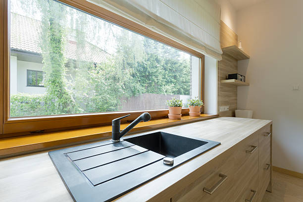 istock Bright kitchen with panoramic view of the neighbourhood 626445444