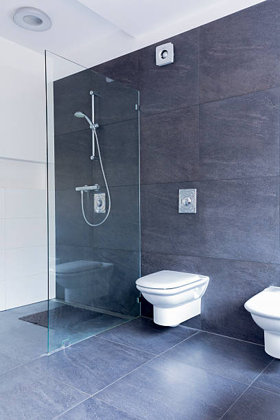 istock Ascetic bathroom combining glass and granite 626445496