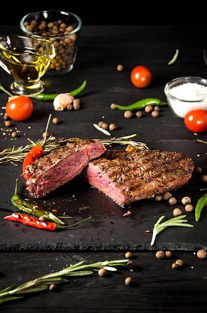 istock rare steak black square plate pepper 626447304