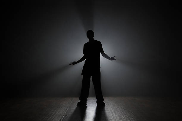 istock Man dancer posing in the dark and smoke 626448270