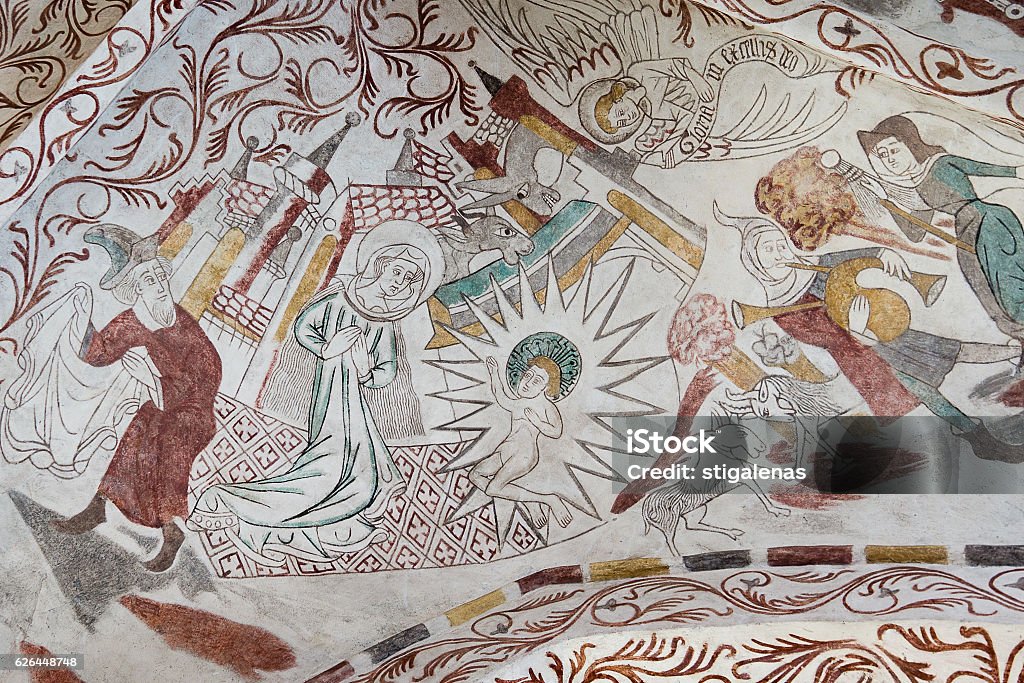 Gothic wall painting of the Christmas Gospel Fresco of the birth in the stable. Over Dråby church, Denmark, nov 14 2016, Nativity Scene Stock Photo