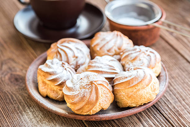 istock Delicious profiteroles with cream dessert. 626449382