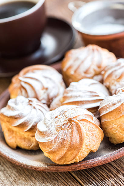 istock Delicious profiteroles with cream dessert. 626449586