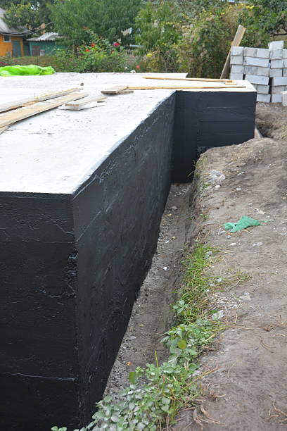 istock Waterproofing house foundation with bitumen spray on tar 626455230