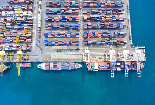 istock container ship in import export and business logistic.By crane , 626455698