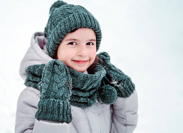 istock Kid Girl Smiling Winter Portrait 626456342
