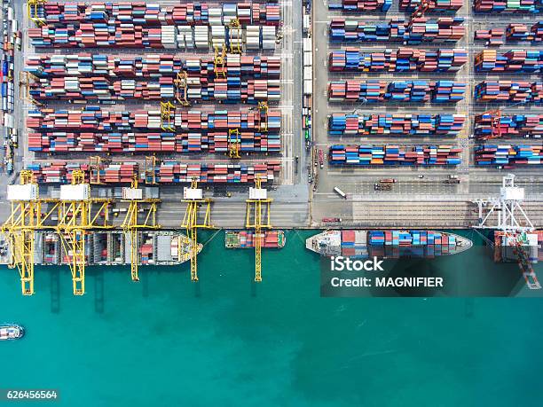 Container Ship In Import Export And Business Logisticby Crane Stock Photo - Download Image Now