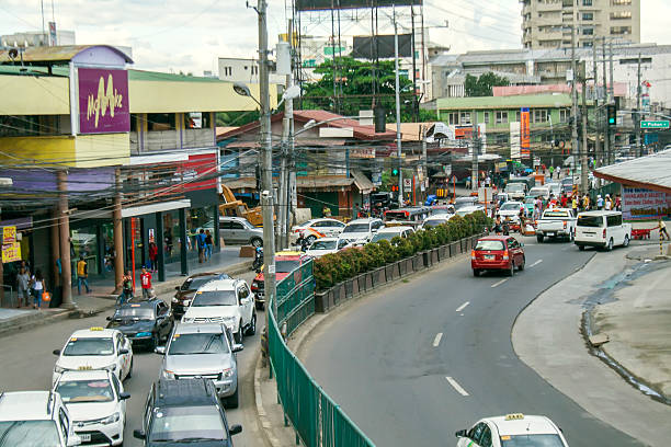 Streets, Landmarks, places, and businesses of Davao Davao, Philippines - November 21, 2016: Mc. Arthur Highway near Bankerohan Public Market davao city stock pictures, royalty-free photos & images