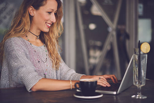istock Typing on the laptop in the cafe 626458038