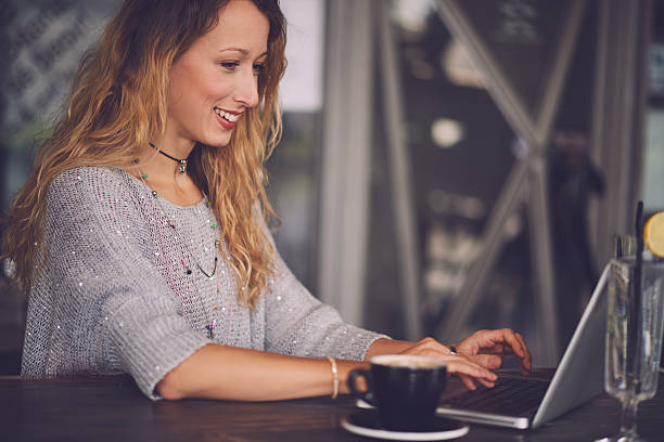 istock Typing on the laptop in the cafe 626458218