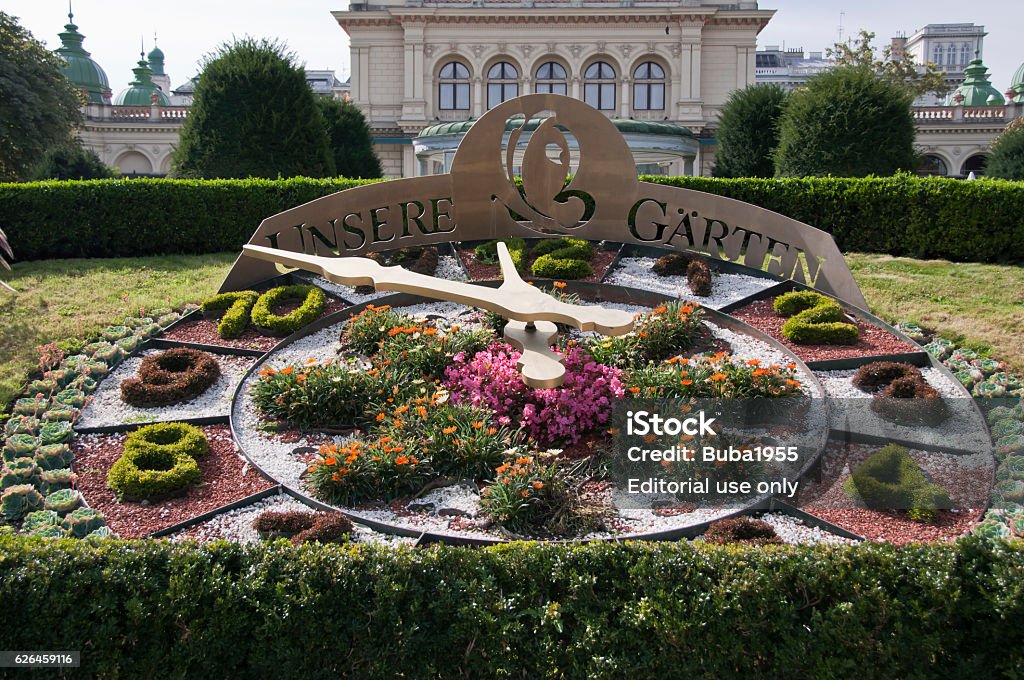 Kursalon and “Unsere Garten” flower clock, Vienna Vienna, Austria - September 23, 2016: Kursalon and “Unsere Garten” (Our Garden) - a functioning flower clock in the City Park (Stadtpark). Kursalon is a popular concert hall in Stadtpark where music of Mozart and Johann Strauss is often played. Architecture Stock Photo