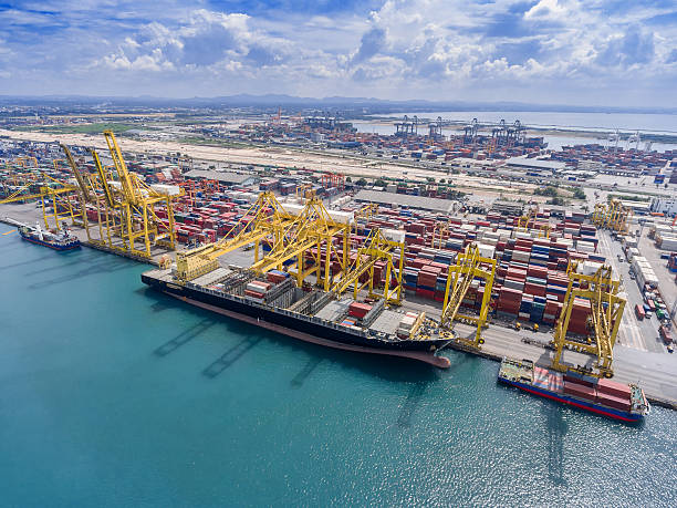 istock container ship in import export and business logistic.By crane , 626459438