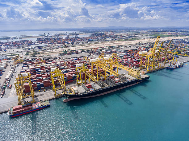 istock container ship in import export and business logistic.By crane , 626459666