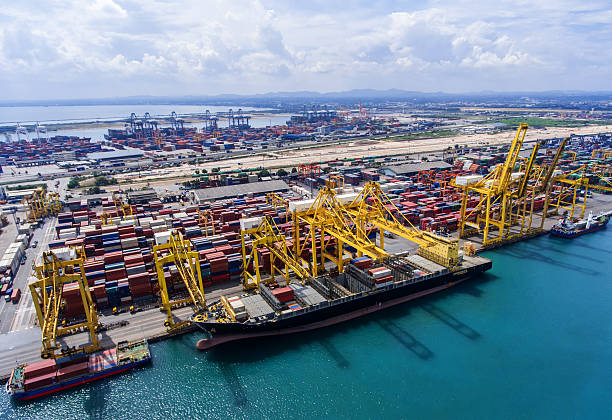 istock container ship in import export and business logistic.By crane , 626459802