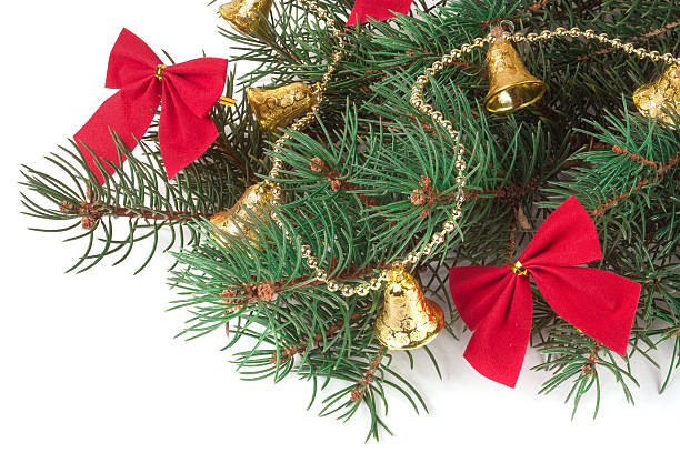 istock branch of Christmas tree with short needles decorated  bells and 626459876