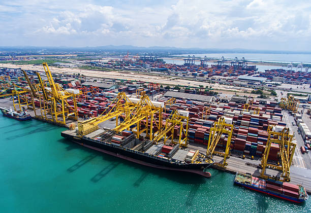 istock container ship in import export and business logistic.By crane , 626460004