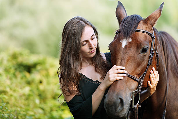 istock Woman with her horse 626460158