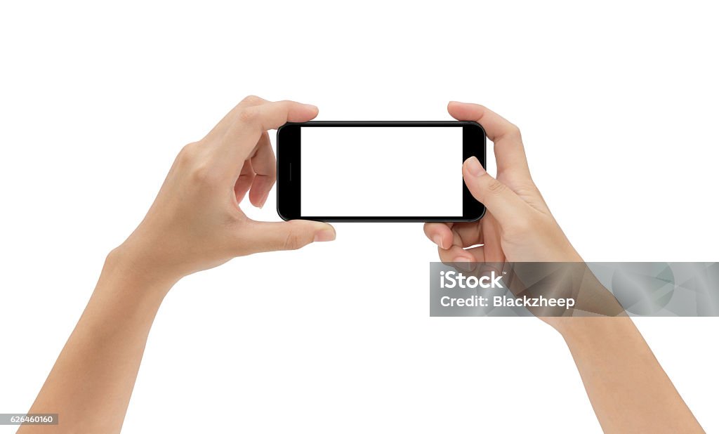 hand holding phone isolated on white background hand holding phone isolated on white background, mock-up smart phone matte black color Mobile Phone Stock Photo