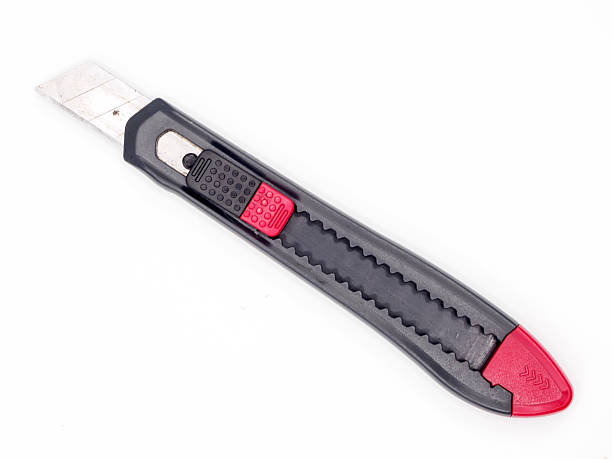 istock Black and red plastic cutter knife isolated 626460908