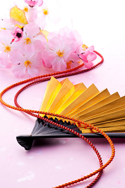 istock Fan and pink flowers 626461812