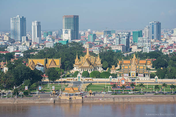 Phnom Penh Cityscape Phnom Penh Cityscape. Foreground- The Royal Palace, in Phnom Penh, Cambodia, is a complex of buildings which serves as the royal residence of the king of Cambodia. Its full name in the Khmer language is Preah Barum Reachea Veang Chaktomuk Serei Mongkol. cambodian culture stock pictures, royalty-free photos & images