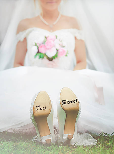 istock Bride with 'Just Married' written on shoes 626461982