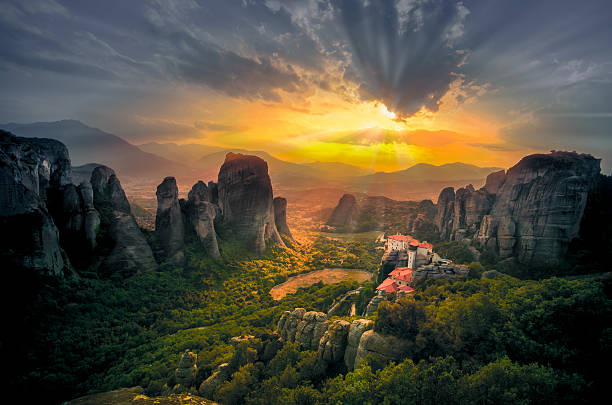 Breathtaking view of Meteora, Greece Breathtaking view of Meteora Roussanou Monastery at sunset, Greece monastery stock pictures, royalty-free photos & images