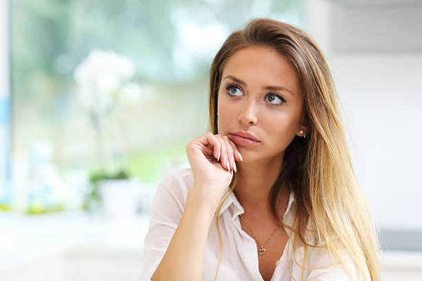 istock Young sad woman in kitchen 626464116