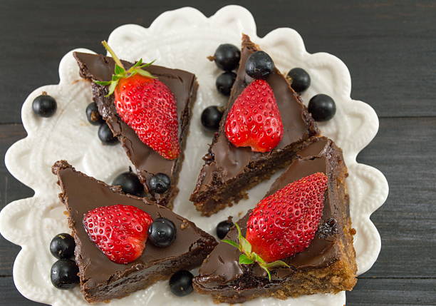istock chocolate cake with whole strawberries on top 626464476