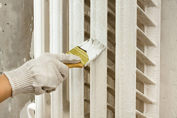 istock hand painting radiator central heating 626465364