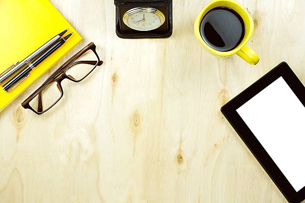 istock Tablet PC cup of coffee and office supply on table 626465434