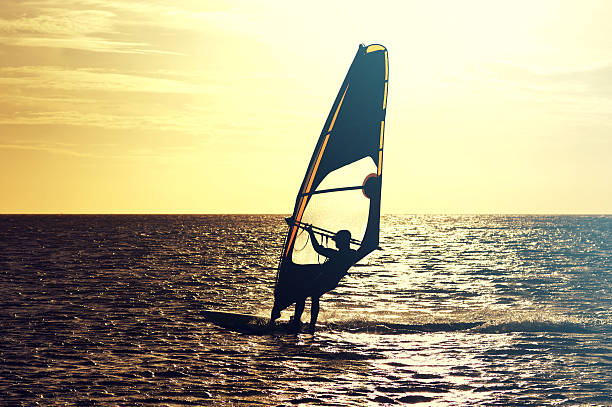 istock Windsurfer sailing at sunset, West Wittering 626465914