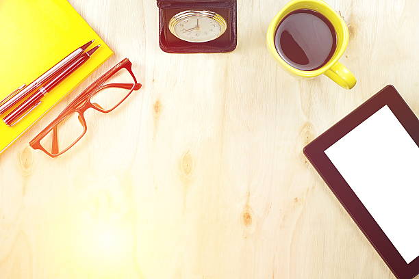 istock Tablet PC cup of coffee and office supply on table 626466002