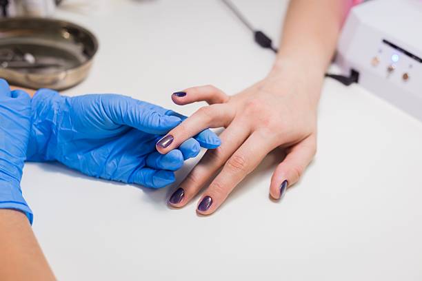 istock Nails painting with brush in nail salon 626468300