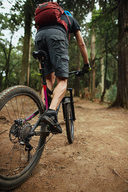 istock Back view and low angle of latin man cycling 626487194