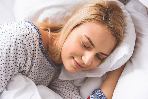 istock Calm young woman sleeping at home 626487590