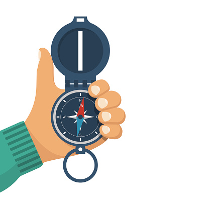 Man holds a compass in hand. Magnetic navigation device. Equipment for orientation of the traveler. The investigation of the area. Vector illustration flat design. Isolated on white background.