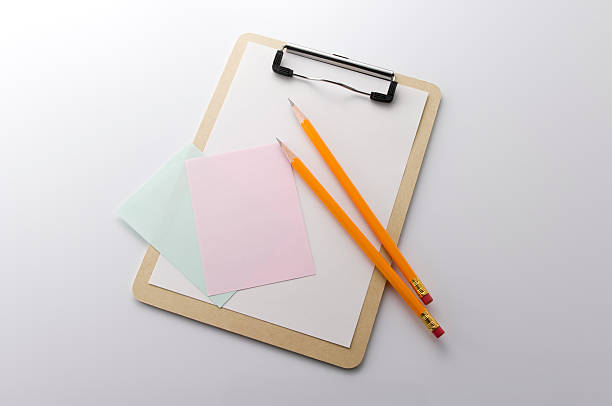 istock Paper on clipboard with pencil 626490842