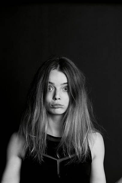 istock Young beautiful girl builds faces. Hamming 626500520