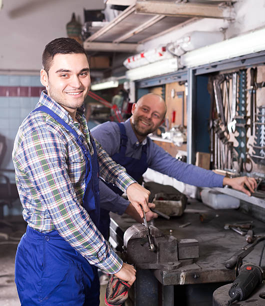istock Workmen in repair shop 626500816