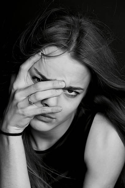 istock Young beautiful girl builds faces. Hamming 626501156