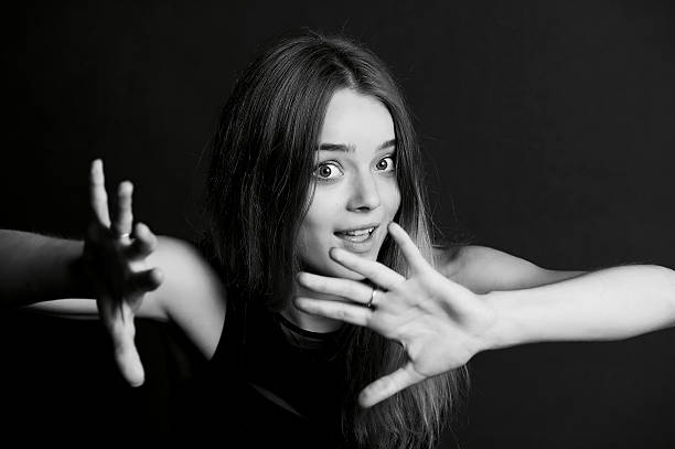 istock Young beautiful girl makes magical passes with his hands. 626502158