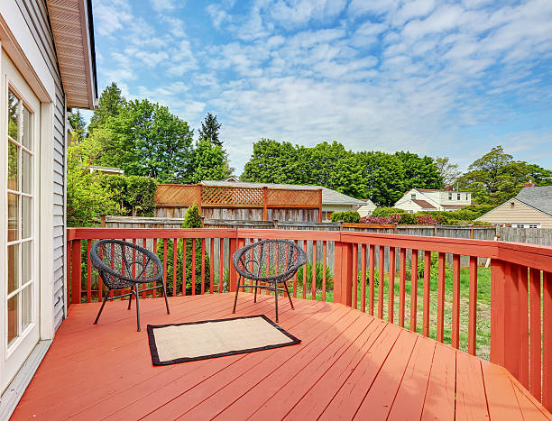 istock Backyard of craftsman home with red deck 626502160
