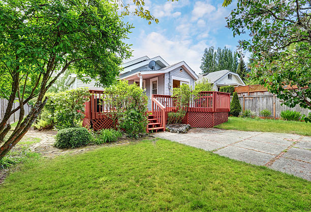 istock Backyard of craftsman home with red deck 626502434