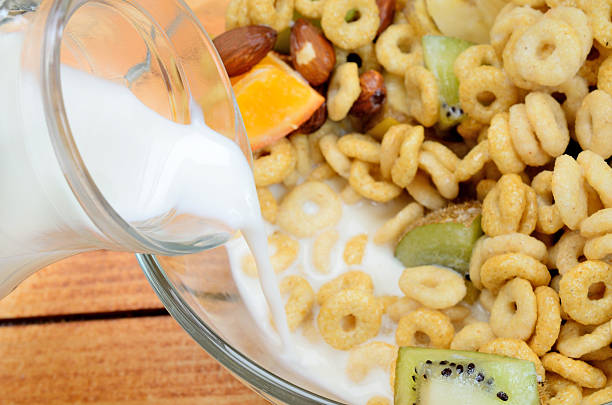 istock milk flow in bowl with cereal 626511032