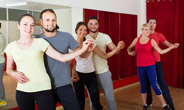 istock Group of people dancing salsa in studio 626511278