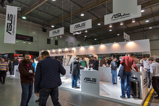 Kiev, Ukraine - October 9, 2016: Unrecognized people visit Asus, a Taiwan based international computer company booth during CEE 2016.