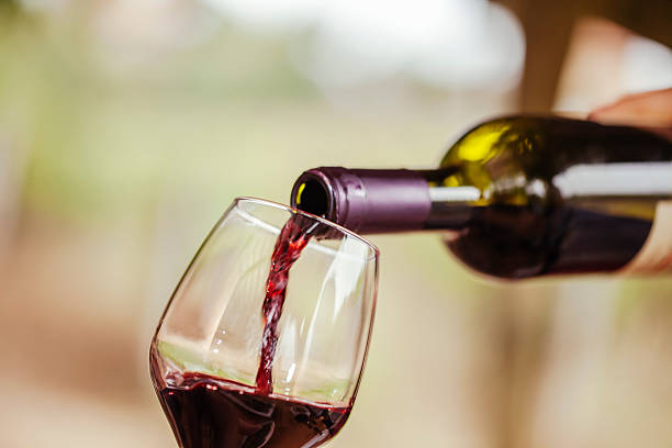 Red Wine Red Wine Being Poured In The Glass pouring stock pictures, royalty-free photos & images